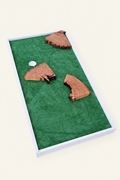 Cornhole board with natural wood pieces on a grassy background